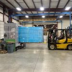 Forklift driver using TAB Wrapper Tornado orbital wrapper to stretch wrap pallet load at Penn Sheet Metal, Allentown, PA